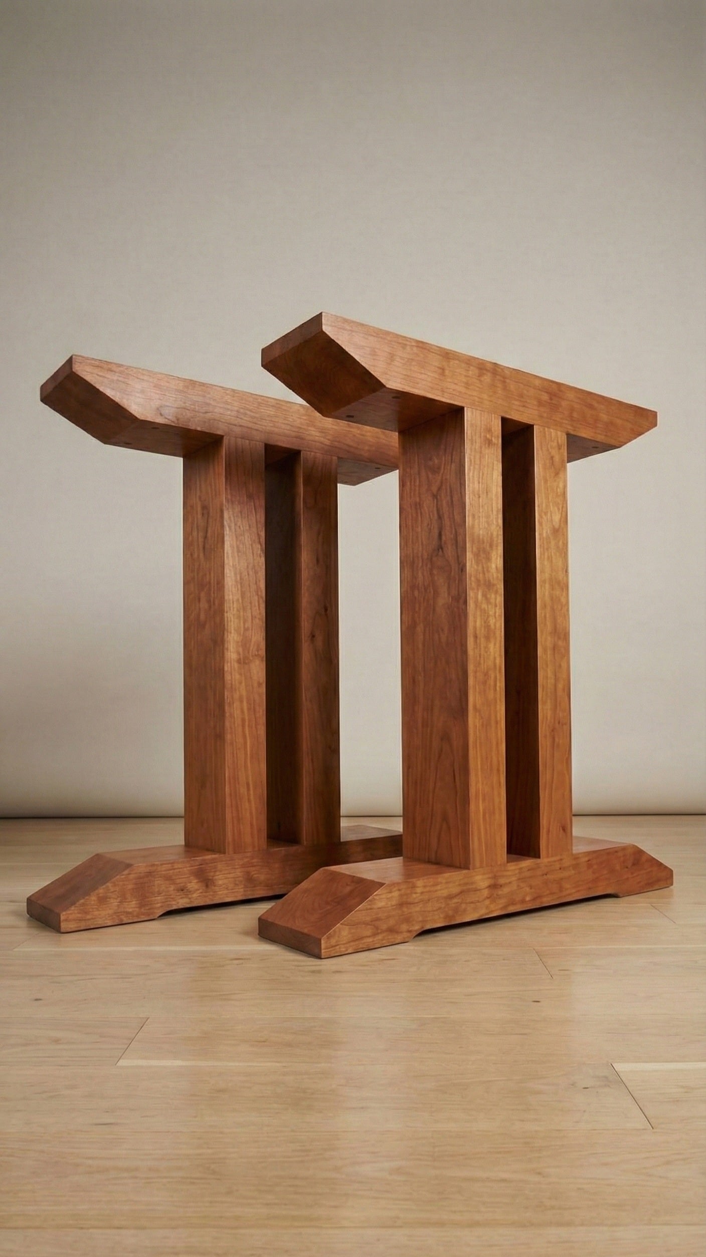 Geminis handcrafted table base in Cherry – pair shown – Artisan & Sons